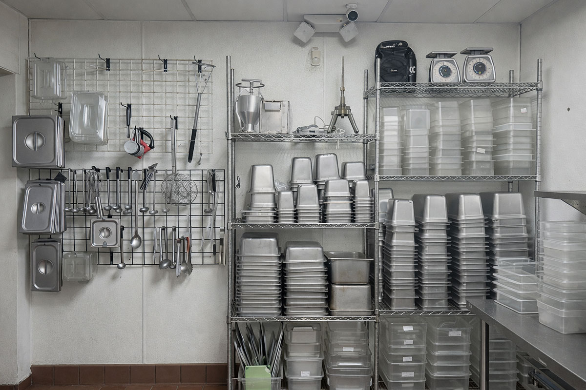 Kitchen Storage & Prep Area | Cedar Park TX Restaurant Property Restaurant kitchen storage and prep area with shelving and containers in Cedar Park Texas on RM 620 corridor